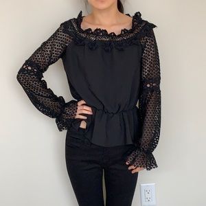 Black top with embroidery details